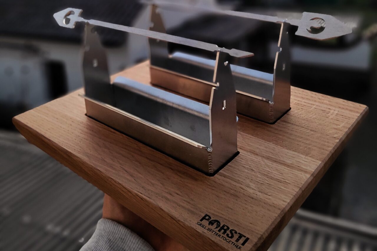PORSTI Flameboard Produktbild gegen SOnnenuntergang